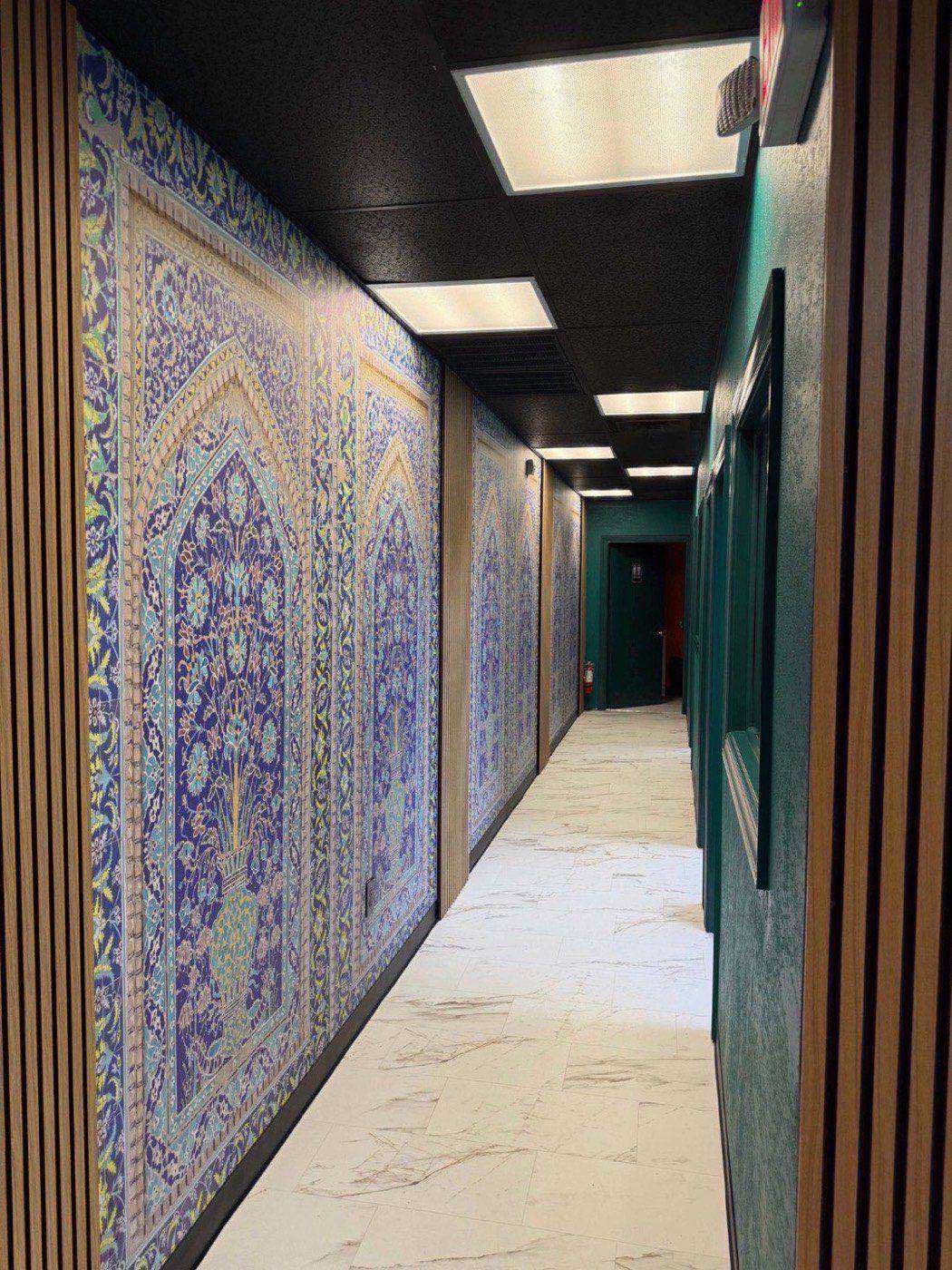 Ornate hallway at Silk Road Restaurant with gold arches and warm lighting