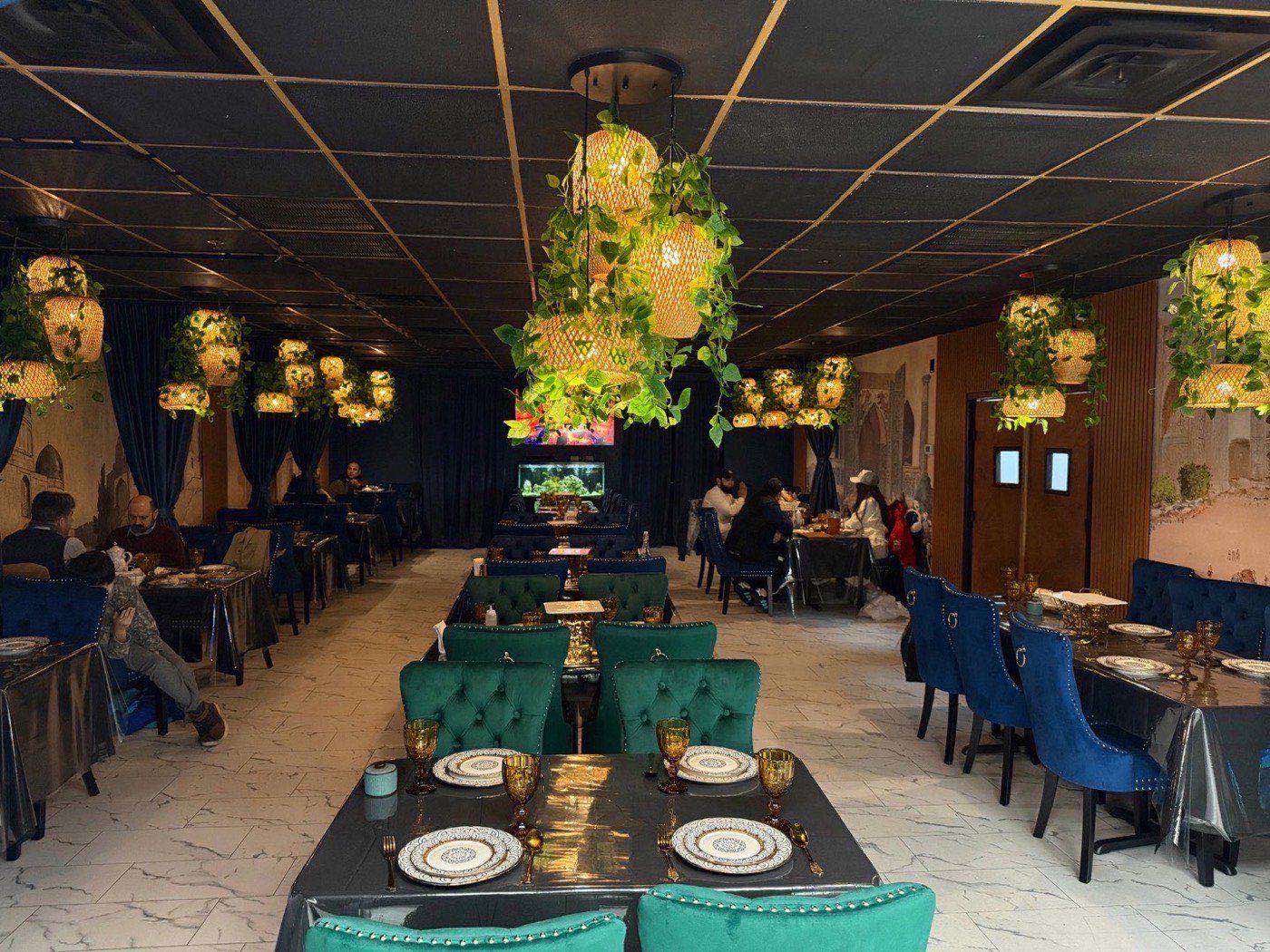 Main dining room at Silk Road Restaurant with ornate arches and warm golden light